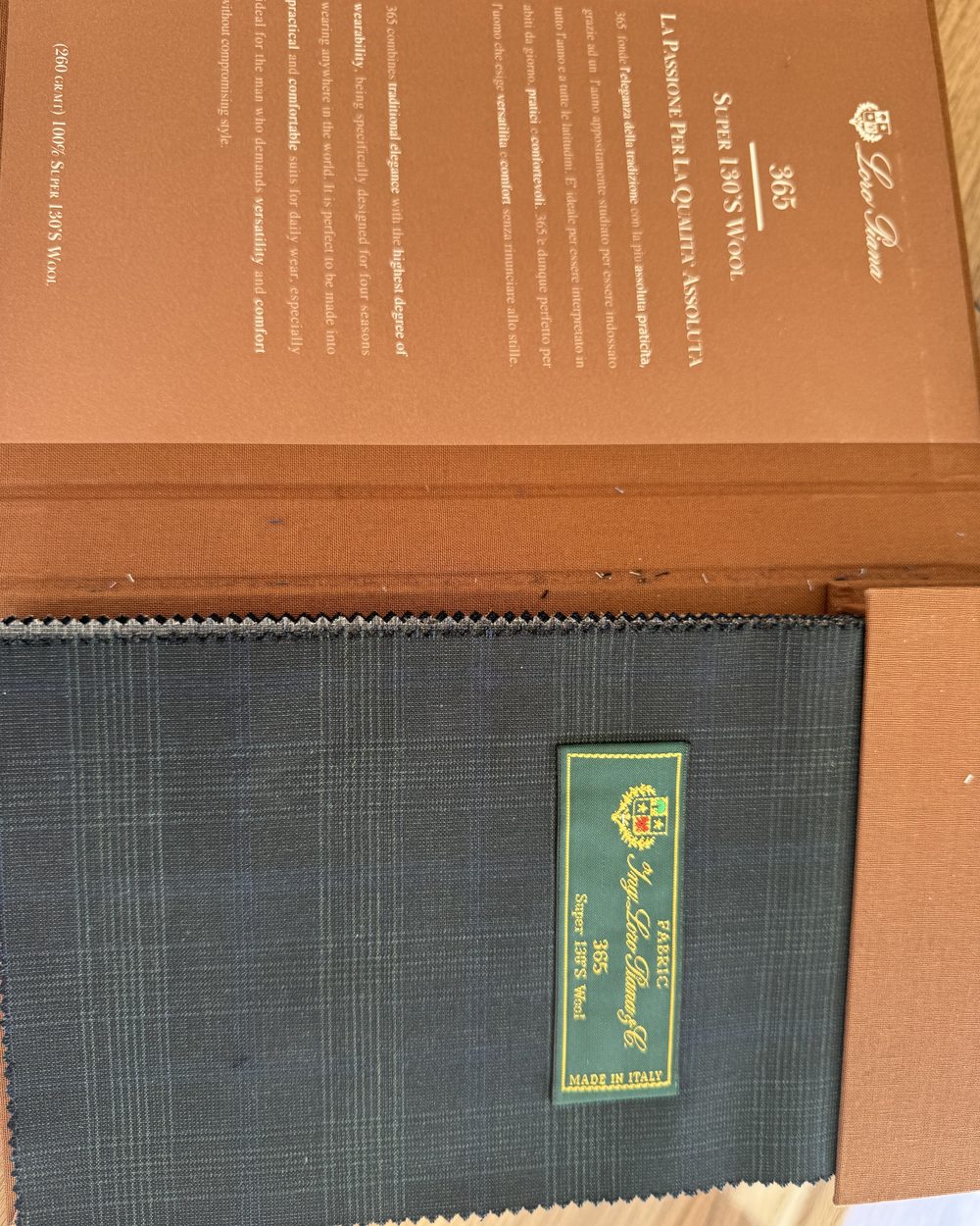 Loro Piana 365 Super 130's wool swatch book, open to a glen check