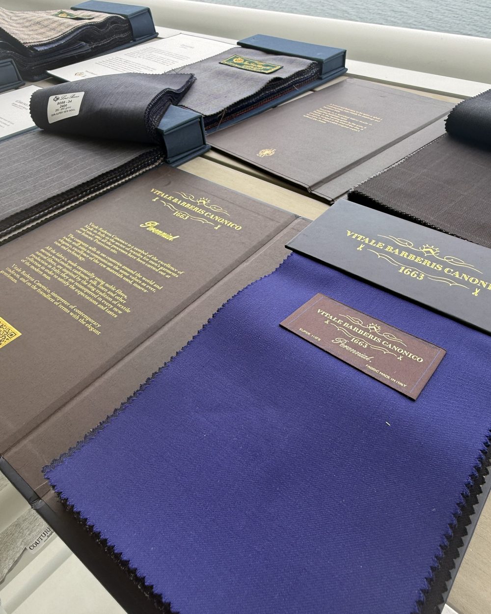 Vitale Barberis Canonico 1663 swatch book with a cobalt wool swatch