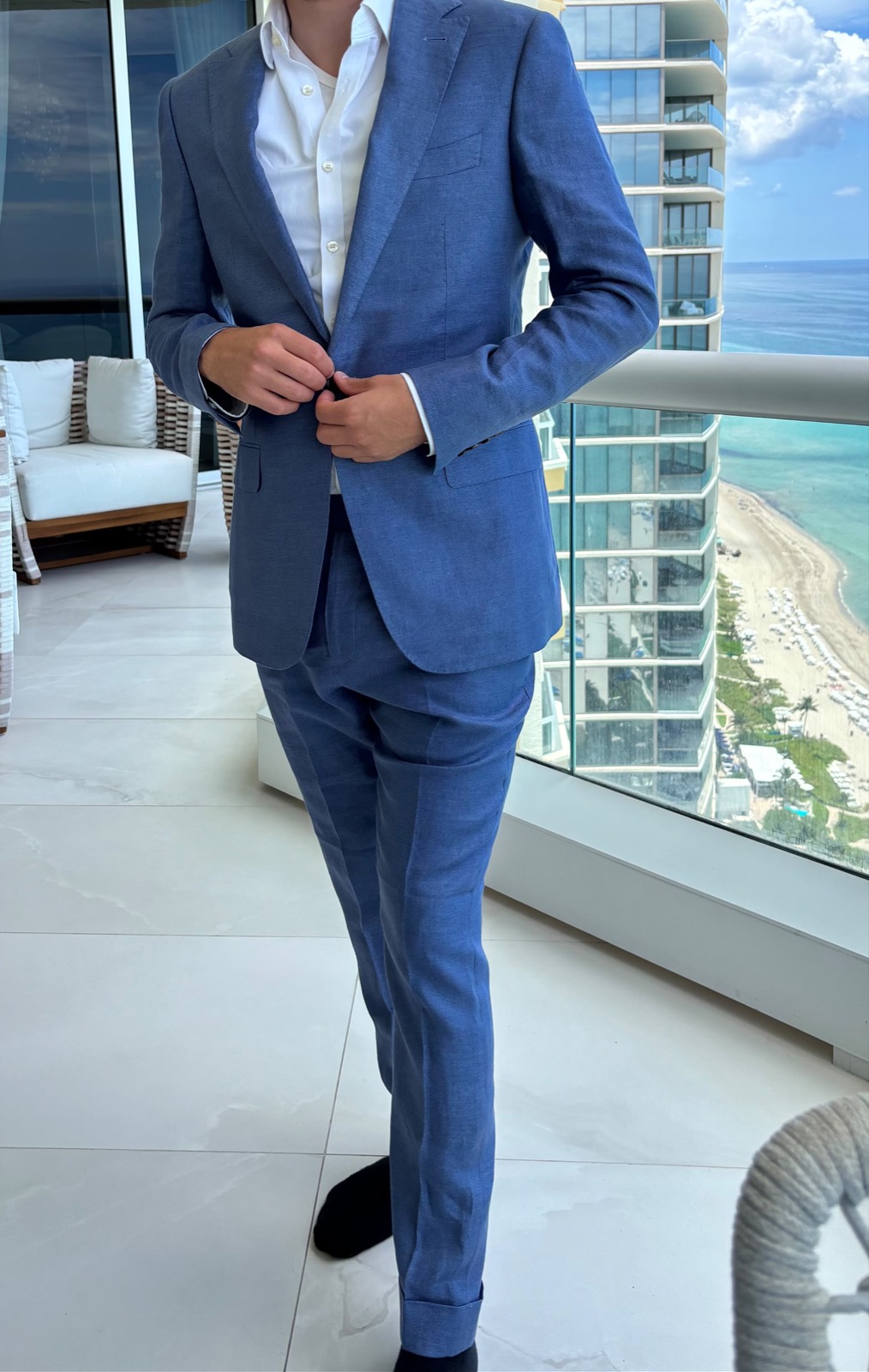 Client in a blue Oliel suit, Miami highrise