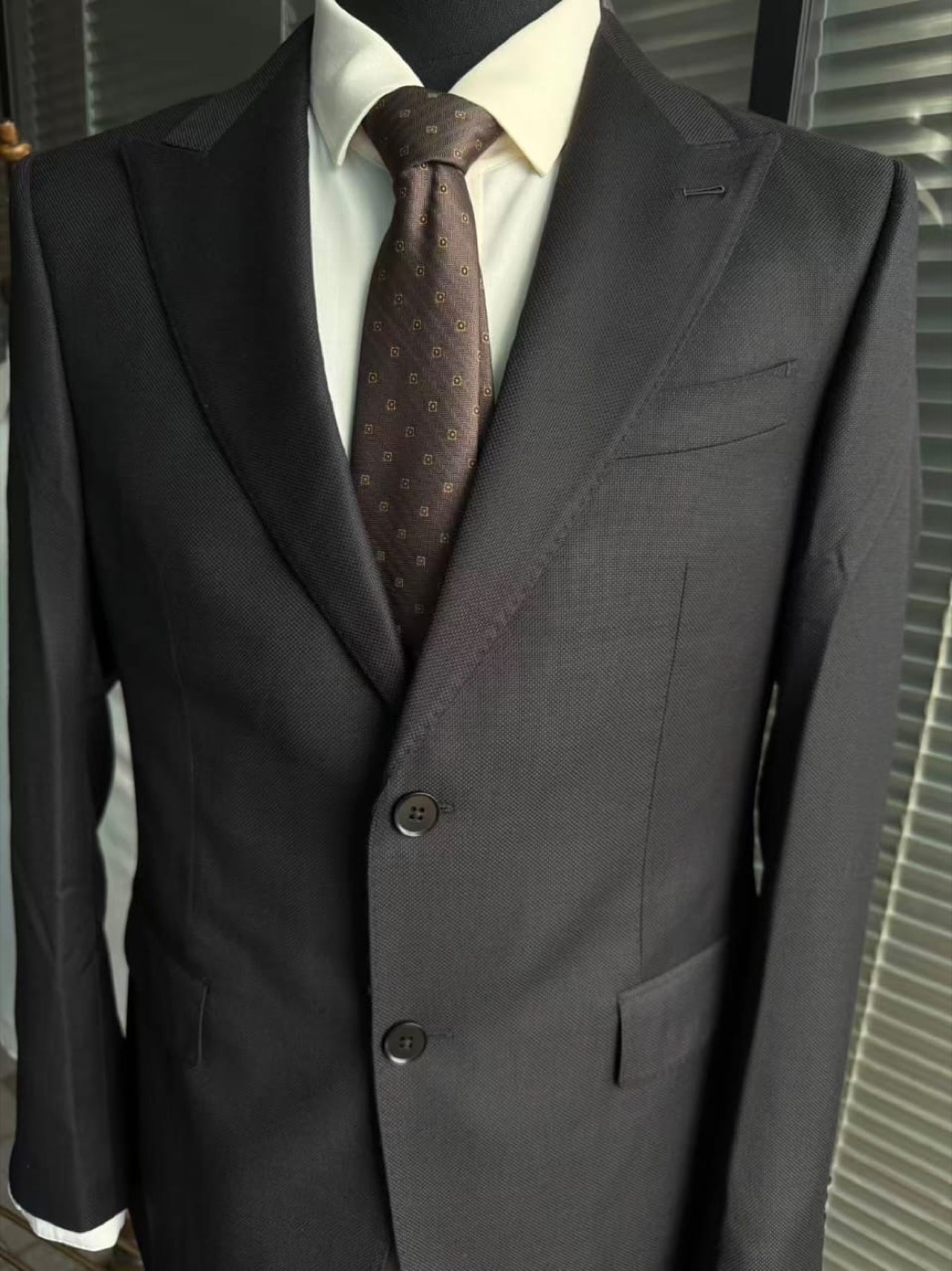 Black made-to-measure suit with peak lapels