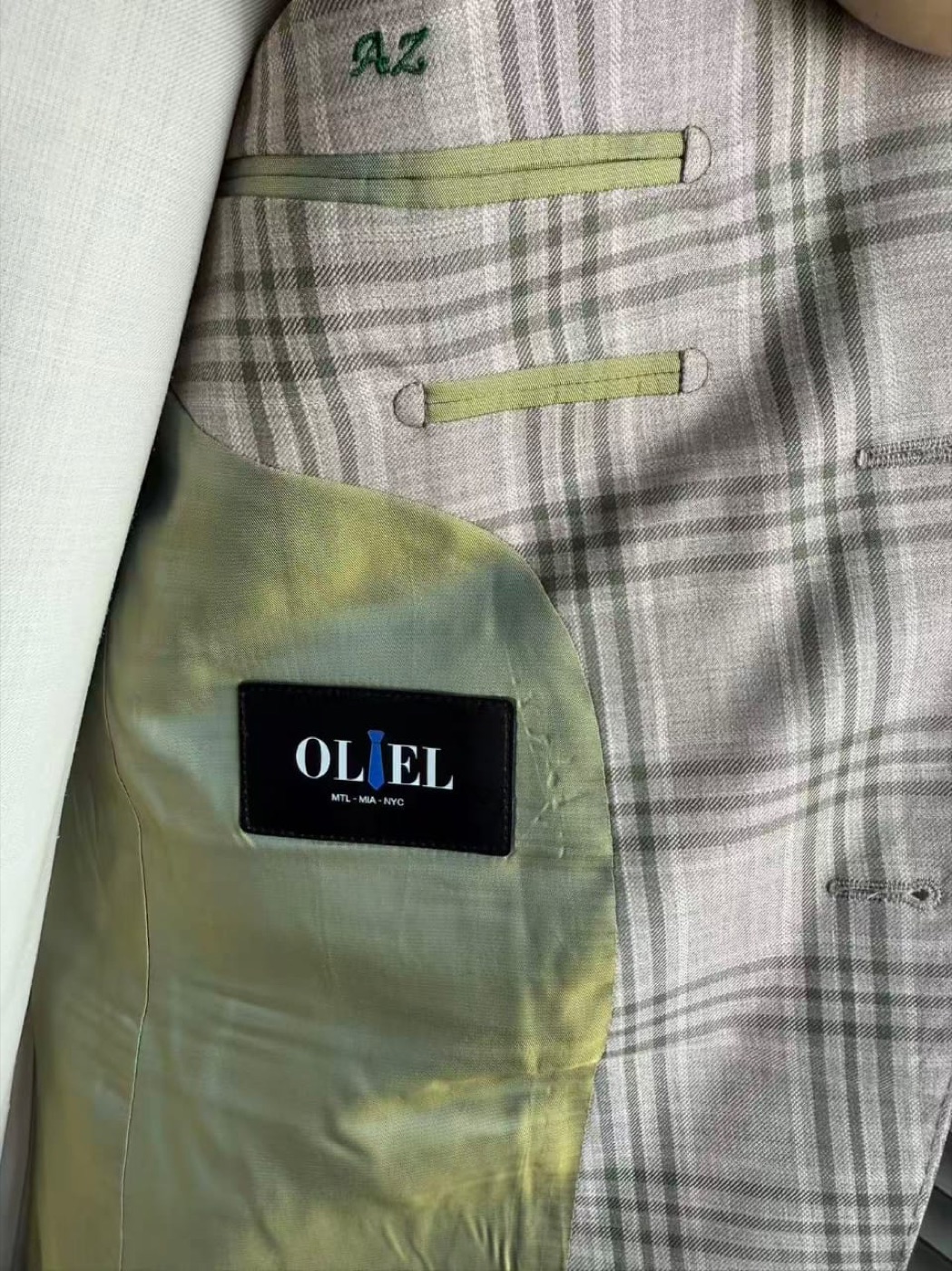 Grey glen-check suit with brown tie